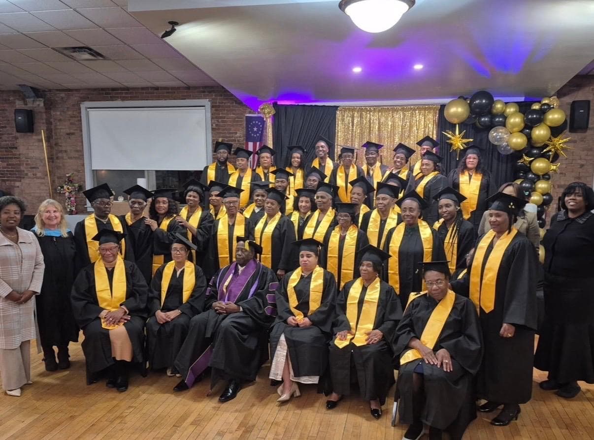 R.I.S.E. Program graduates in caps and gowns celebrating their achievement